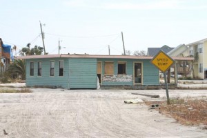 This was taken on our long walk on sand covered roads after Hurricane Ivan to retrieve whatever was not destroyed and that we could carry on our backs. Please note that house was previously on a foundation two blocks away and is ended up residing in the middle of my street.