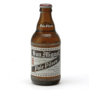 This is a photo of the San Miguel beer bottle with the old-style label, the shape of the bottle is very distinct. This beer holds a legendary status among servicemen who were stationed in the Philippines.