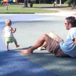 Nora and Daddy playing in the splash area