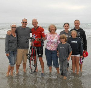 This was a photo taken from his blog..."Today we finished packing and said goodbye to some of our family. Jon, Marcie, Kol, Agi, Maya and Christian joined us for a pasta (carbo loading) dinner.  We went to the beach by our condo in Oceanside, CA and dipped the rear wheel in the Pacific, next time the Atlantic." title=