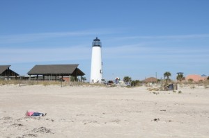 Can you see the little munchkin lying on the beach? She loves to get sandy!