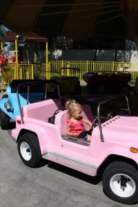 One of the few rides Nora could ride on, but she was a big girl and rode all by herself on some of them!