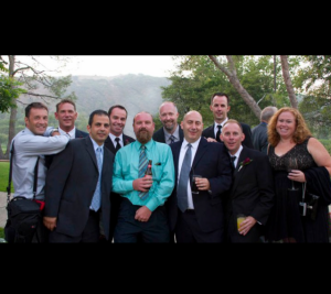 This was taken at Sean's wedding. Skippy is the one front and center with the teal shirt. Their were 2 guys missing from the sot, Kevin and Sean as they were probably off spooning somewhere *LOL*