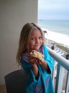 Nora enjoying her breakfast on the hotel room balcony.